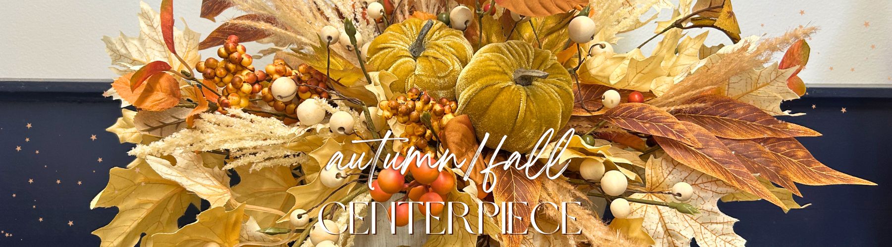 fall centerpieces with leaves, berries and pumpkins