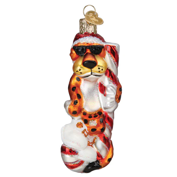 Introducing the Chester Cheetah on Candy Cane Ornament from Old World Christmas (#12660). This delightful glass ornament features Chester Cheetah dressed in black sunglasses, a Santa hat, and a striped red and white scarf. Striking a relaxed pose adorned with glitter accents, this cool cat perfectly captures the festive spirit while resembling your favorite candy cane ornament.