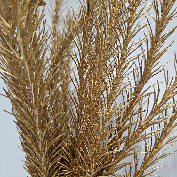 Close-up of the 16" Gold Christmas Salix (Product code: 83552-GOLD) against a pale background. These intricately detailed branches feature a shimmering metallic finish, imparting a luxurious and elegant appearance.