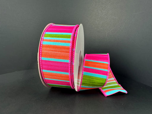 The 1.5X10Y Fuchsia Orange Aqua Lime Watercolor Horizontal Stripes Ribbon (41509-09-46) is displayed against a dark backdrop, with one end unrolled to reveal its vibrant pink, orange, green, and blue stripe pattern.