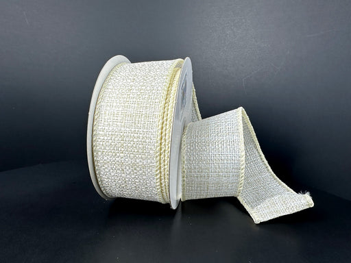 A partially unrolled 1.5X10Y Ivory-Tan Tweed Solid Ribbon 41512-09-18 with a textured woven pattern and slight shine is set against a dark background.