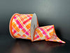 A roll of 2.5X10Y Neon Orange Fuchsia White Diagonal Cabot Printed Plaid Ribbon (41523-40-19) is partially unspooled with its vibrant colors, set against a stark black background.