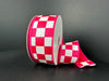 A partially unwound roll of the 1.5X10Y Fuchsia Ribbed Satin/White Racechex Ribbon stands out against a dark gray background, with its bold checkered design offering an eye-catching display reminiscent of race check patterns.