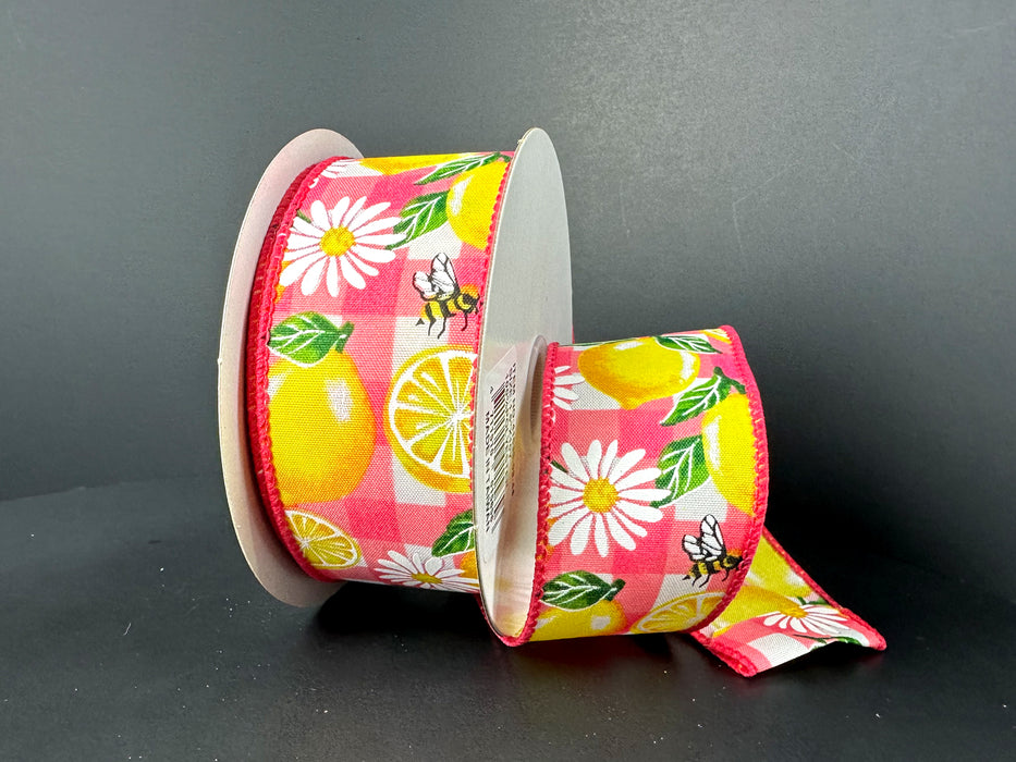 Two spools of 1.5x10Y Fuchsia Watercolor Plaid with Lemons and Daisies Ribbon feature vibrant lemons, daisies, bees, and green leaves on a vivid pink and white checkered background.