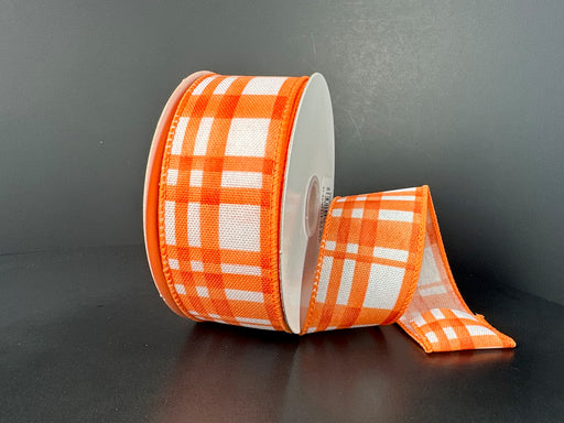 A 1.5x10Y roll of orange watercolor Tuttola plaid ribbon (product code: 41546-09-19) is partially unrolled against a dark gray background.