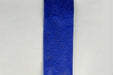 A close-up view of the 2.5" by 10 Yard Royal Blue Flower Embossed Ribbon 42466-40-25, showcasing its intricate floral and leaf patterns, set against a plain, light gray background.