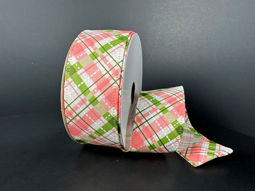 A partially unrolled roll of 1.5X10Y Cream Coral Moss White Diagonal Linen Argyle Ribbon 46512-09-46 is set against a plain, dark background.