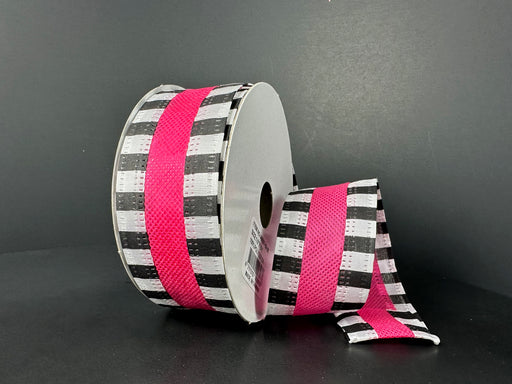 The 1.5X10Y Fuchsia Flat Breeze/Black And White Stripe Edge Ribbon (46521-09-28) displays a black and white checkerboard pattern with a vibrant fuchsia center stripe, unrolled partially against a dark background for added elegance and flair.