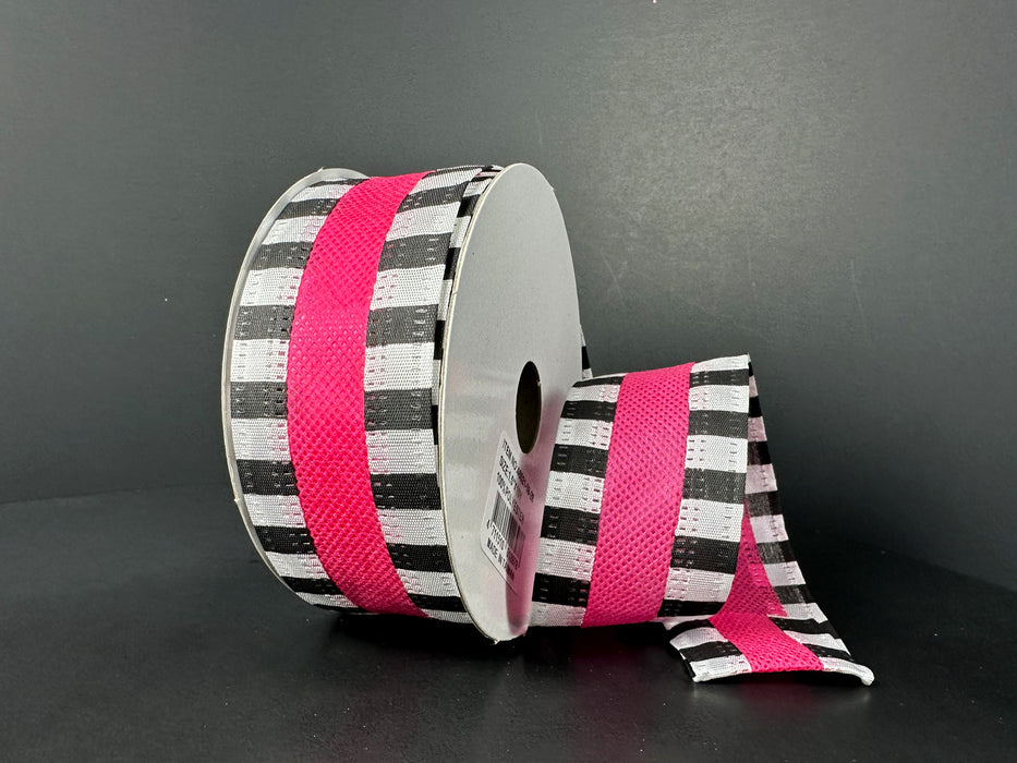 The 1.5X10Y Fuchsia Flat Breeze/Black And White Stripe Edge Ribbon (46521-09-28) displays a black and white checkerboard pattern with a vibrant fuchsia center stripe, unrolled partially against a dark background for added elegance and flair.