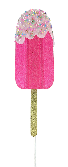 The 21" by 4" by 1.5" Pink Sprinkle Popsicle Spray, product code 86105PK, is a captivating glittery pink popsicle with a white icing top and vibrant sprinkles, beautifully mounted on a gold stick.