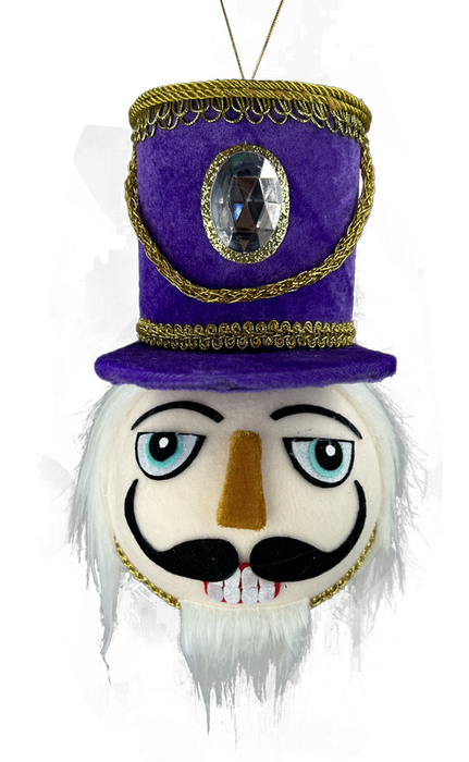 Introducing the 10" by 7" Purple Nutcracker Soldier Head Ornament (86119PU), featuring a striking purple velvet top hat with intricate gold trim and a prominent gem. The detailed face includes blue eyes, a black mustache, white beard, and distinctive red-and-white teeth, framed by elegantly styled white hair.