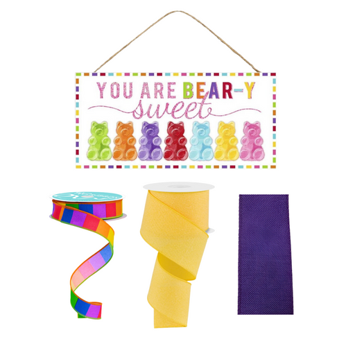 The #2 Version of You are Bear-y Sweet Valentine Sign features You are BEAR-Y sweet with gummy bears, plus a 3 Ribbon Bundle with rainbow stripes, yellow, and solid purple spools for crafting. (Product ID: 0123024).