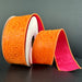 A partially unrolled roll of 1.5X10Y Orange Fuchsia Double Sided Embossed Dupioni Ribbon features intricate floral patterns against a dark backdrop. This elegant wired ribbon has a contrasting pink reverse, adding sophistication.