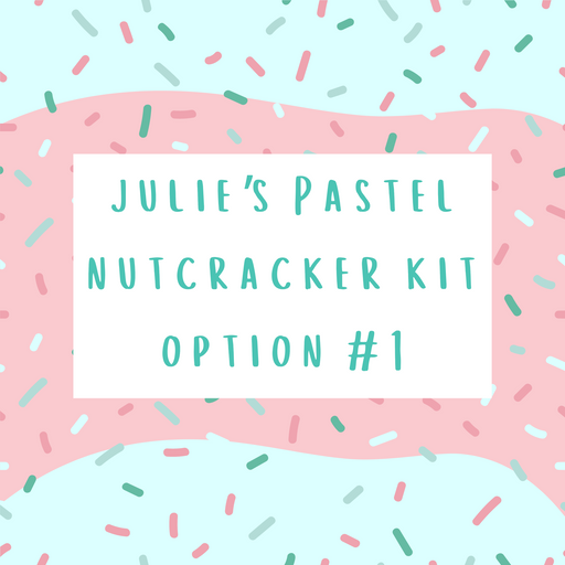 A pastel-colored promotional graphic features Julie's Pastel Nutcracker Wreath Kit Option 1-100924 on a white rectangle. The background displays wavy pink and blue sections, decorated with scattered sprinkles, reflecting the whimsical charm of the Pastel Nutcracker collection.