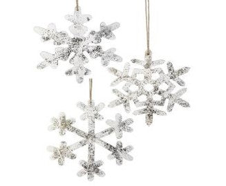 Three 9" MDF snowflake ornaments, each featuring a unique and intricate design, hang against a white background. These glittery silver ornaments, identified by the product code MTX70852, offer assorted styles to complement any decor.