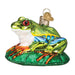 The Red-eyed Tree Frog Ornament from Old World Christmas (12632) features a vibrant design with large red eyes and a stunning array of green, blue, and orange hues. It is elegantly perched on a green base decorated with tropical leaves and includes a gold loop for easy hanging.