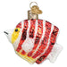 Introducing the Peppermint Angelfish Ornament from Old World Christmas (Product Code: 12635): This stunning ornament captures the essence of aquarium life with its vibrant red and white stripes, accented by yellow markings near the face and shimmering glitter details. It features a gold loop for easy hanging and comes with a charming heart-shaped tag—an ideal tribute to this unique marine species from the Central Pacific Ocean.