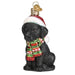 The Holiday Black Labrador Puppy Old World Christmas Ornament 12638 features a black Labrador puppy wearing a Santa hat and a colorful, festive scarf. Complete with a shiny golden loop for easy hanging, this delightful ornament brings holiday cheer to any tree.