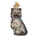 A charming Cairn Terrier Ornament from Old World Christmas (12643) features a festive glass design with glitter accents, a blue collar adorned with a red pendant, and a gold top for hanging, making it an enchanting piece in the terrier breed collection.