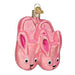 The Pink Bunny Slippers 32406 Old World Christmas Ornament is a delightful pink ornament shaped like bunny slippers, complete with adorable faces and ears. This delicate glass piece is meticulously hand-painted and features a golden loop at the top for easy hanging.