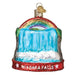 The Niagara Falls 36268 Old World Christmas Ornament features a hand-painted glass design that beautifully captures the essence of Niagara Falls, complete with a rainbow gracefully arching above. Its vibrant red base prominently displays "NIAGARA FALLS" in bold white lettering. This exquisite piece adds festive charm to any tree while encapsulating the iconic beauty of the falls.