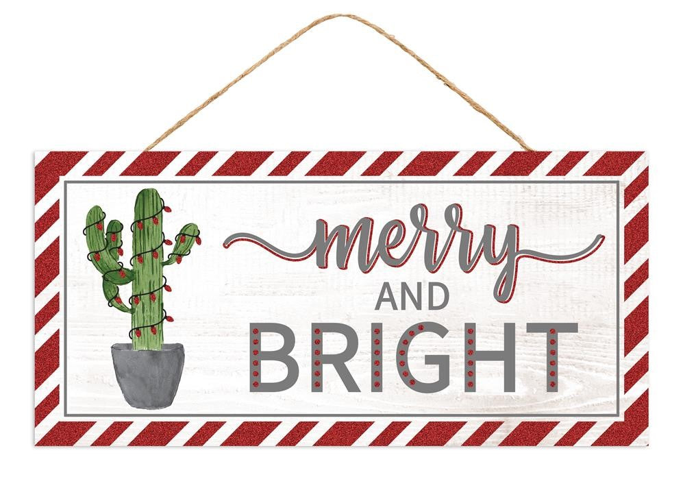 A festive MDF sign with a striped border features a potted cactus decorated with glittering lights beside the text "Merry and Bright," as seen in the 12.5"L X 6"H Merry & Bright Cactus Glitter White/Grey/Red/Green AP8857.