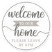 The 12 diameter round metal sign MD0905 features the text Welcome to Our Home, please leave by 9pm in gray, charcoal, and white, with the word home stylized in larger cursive font.