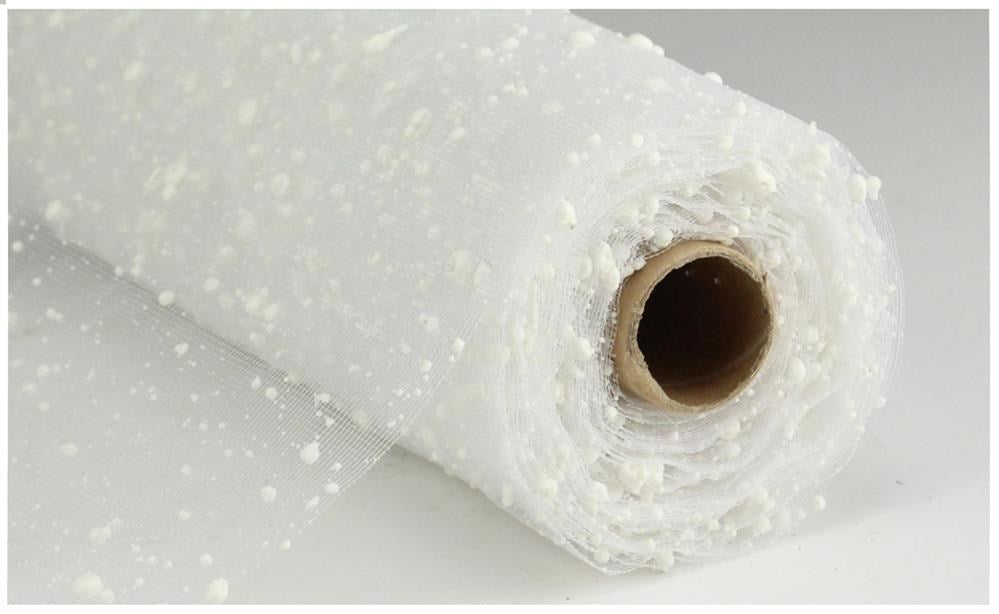 A roll of 10" Snow Mesh White RE550227 fabric with decorative dots is partially unrolled, showcasing its translucent texture. Made from polypropylene, this fabric is wrapped around a cardboard tube and rests on a plain surface.