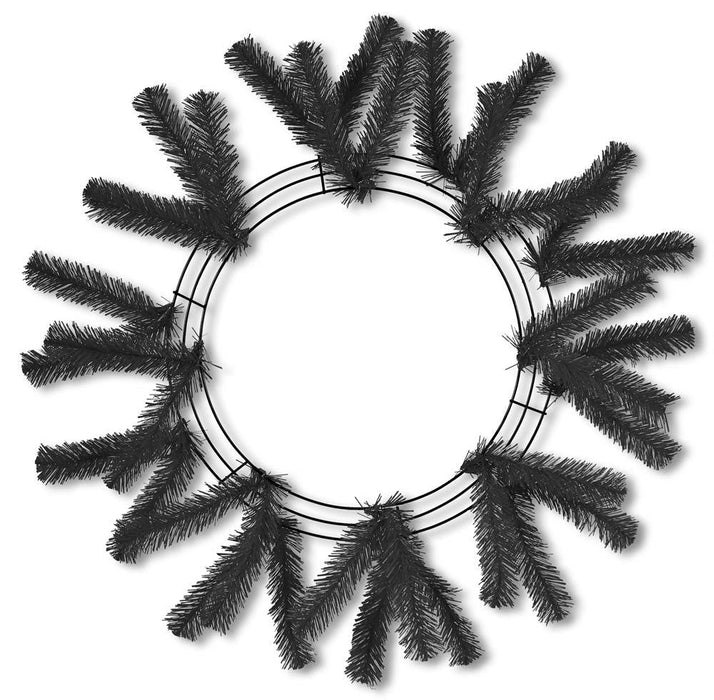 Image of the 24 Black Work Wreath XX748702: A black and white circular frame with sparse artificial pine branches arranged radially and interwoven mesh netting, perfect for holiday decorations.