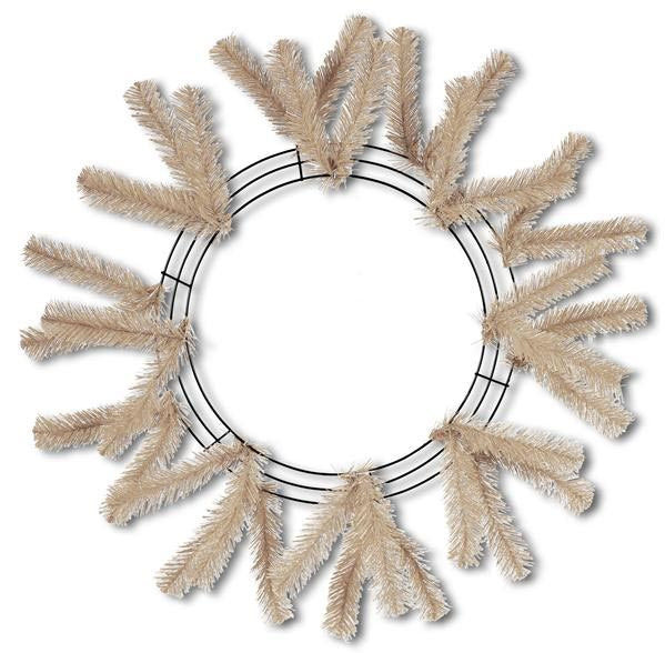 The 24" Work Wreath Burlap Color XX7488W4 features a circular metal frame adorned with beige artificial pine branches arranged in an incomplete design, perfect for crafting decorations. The evenly spaced branches create a large open center, giving it the appearance of a rustic burlap work wreath.